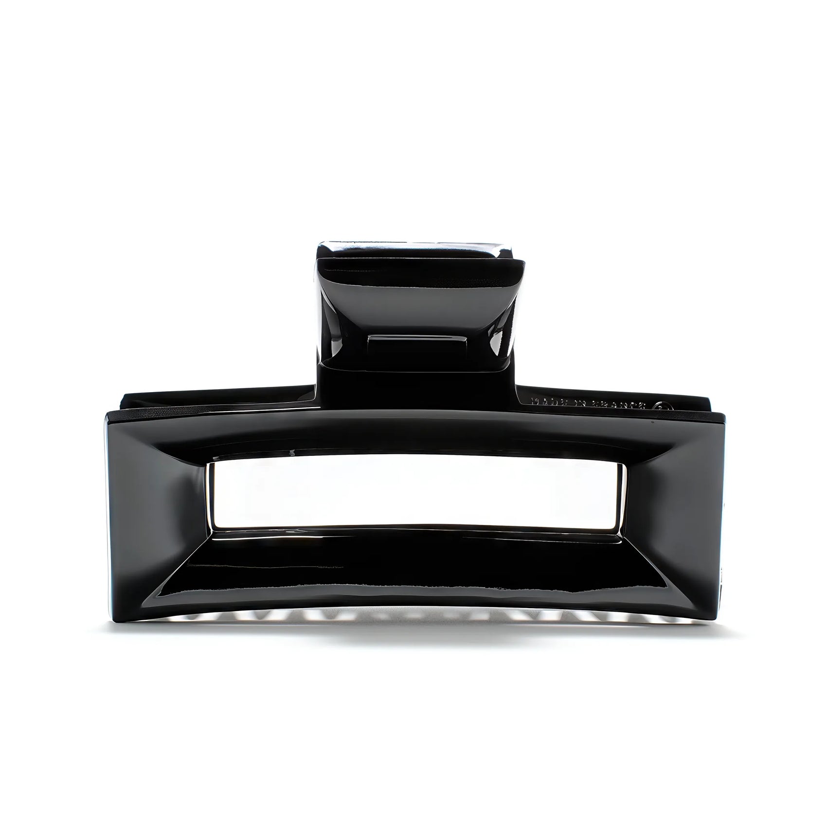 Frame 9 claw clip in Piano Black — architectural jet-black cellulose acetate hair clip, made in France