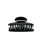 Luna 6 Piano Black claw clip detail — Meera Studio Line, polished black silhouette